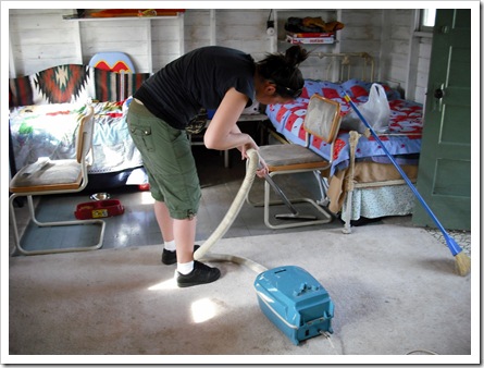 Michaela vacuming the place
