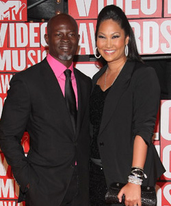 Dijmon Hounsou & Kimora Lee Simmons on the red carpet at the VMA's [image courtesy of Getty images and MTV]