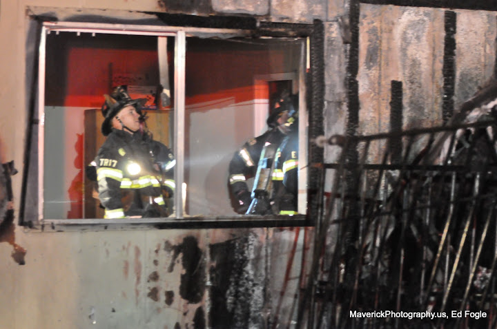 Firefighters examine barbershop blaze