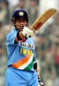 01-india's sachin tendulkar raises his bat after completing century-style