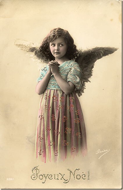 christmas angel in charming dress with hands clasped