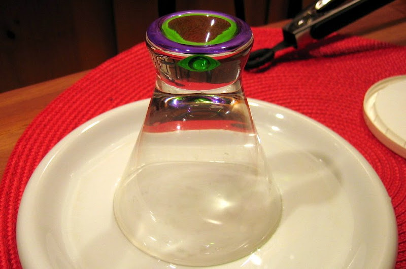 To salt the rim of the margarita glass, first dip it into a shallow bowl filled with water