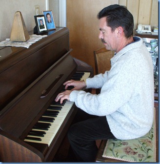 Peter Littlejohn enjoying George Watt's acoustic piano