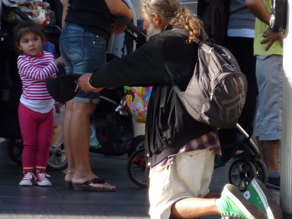 a man asking a child for money