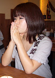 She's...concentrating on something. Not praying.