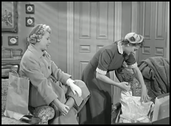 Lucy unwrapping her dress box