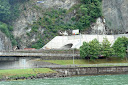 Traffic entering a tunnel on the shore of Lake Lucerne - tunnel having been dug through the mountain - Thumbnail