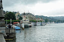 View of the lakefront in Luzern with boats and ships all around - Thumbnail
