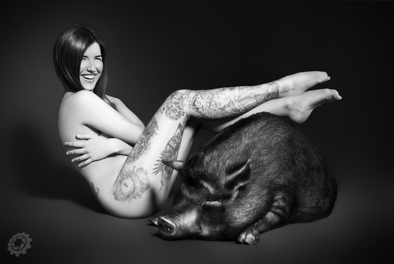 Tattoed girl with wild boar
