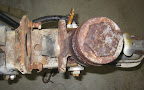 The 1975 original master cylinder. Everything on it is seized up. Luckily I have found out that DICO makes a master cylinder (part #10271) that is a twin and should bolt right in. We'll see when it arrives.