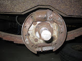 7" x 1 3/4" drum brakes. I have a feeling this whole assembly will be getting replaced due to the small difference in cost