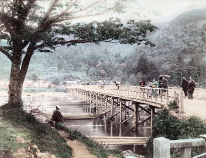 Togetsukyo bridge in Arashiyama, Kyoto, Japan. Horinji Temple can be seen on the hillside. Women in kimono stand on the bridge, a man is fishing under a cherry tree. A boat passes under the bridge. The bridge was destroyed by a flood in 1892. Late 19th century albumen photograph by Tamamura Kozaburo (1856-19??). Togetsukyo bridge in Arashiyama, Kyoto, Japan. Horinji Temple can be seen on the hillside. Women in kimono stand on the bridge, a man is fishing under a cherry tree. A boat passes under the bridge. The bridge was destroyed by a flood in 1892. Late 19th century albumen photograph by Tamamura Kozaburo (1856-19??).
