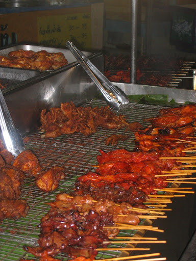 a group of meat on skewers