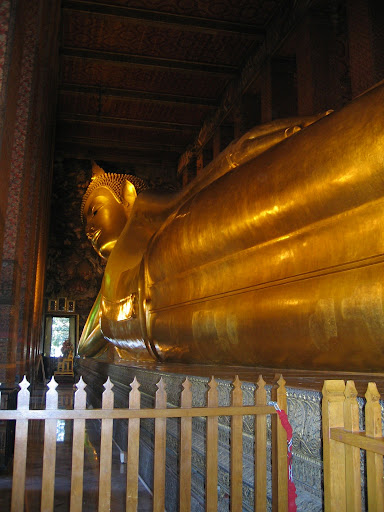a large golden statue of a buddha