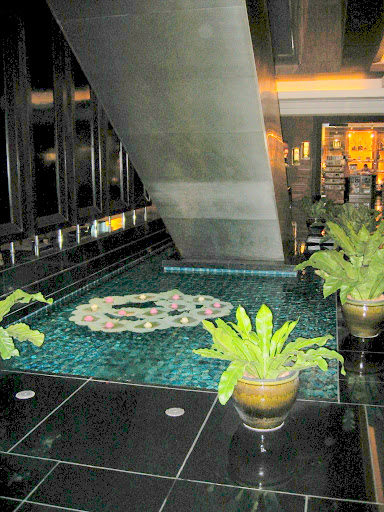 a indoor pool with plants in it