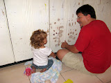 Mollie helping daddy scrape before painting
