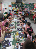 helping with a class at Ankeng elementary school