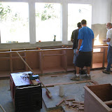 Aria, Chris and Mike install the base cabinets.