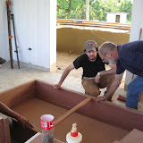 Andy, Mike and Aria working on one of the overhead cabinets.