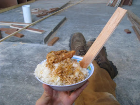 Lunch is rice, chicken and handmade plywood "spoon".