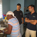 Odelsia teaching Charlie and Jody the secrets to her cooking.