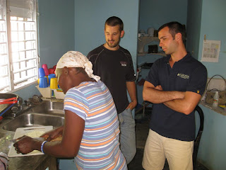 Odelsia teaching Charlie and Jody the secrets to her cooking.