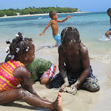 Kamila and Son building a sand castle.