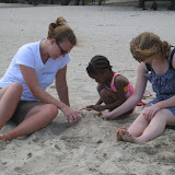 Darling Frid had NO desire to get anywhere close to the water, so we built sand castles.  She found "cosas" to put in them.