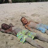One of the most fun games... roll in the sand and then rinse in the water.   Ricardo and Raidi really enjoyed getting dirty.
