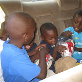 The Chichigua boys going home with new clothes on, bags of old clothes in hand.