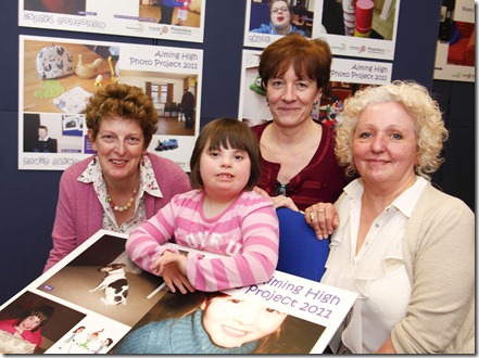 Lily Mae Johnson aged 8 with her photography which was exhibited as part of the Aimin High project  with l-r   Kate Langridge, Ann Clark and Barbara Logan from the Aiming High Project.