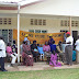 MEMBERS OF SOROTI LIONS CLUB WITH PATIENTS DURING THE EYE CAMP