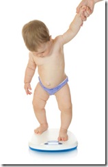 Small baby on home scales isolated Small baby on home scales isolated