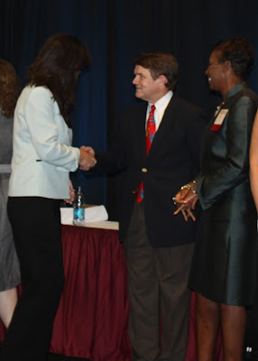 Receiving Medal from Mr. Pastorek and Mrs. Tyler Receiving Medal of Excellence