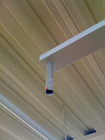 Parking guidance light. One above every parking space. Red means occupied, green means available. Does help!