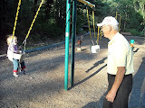 On the swings again with Pop Pop