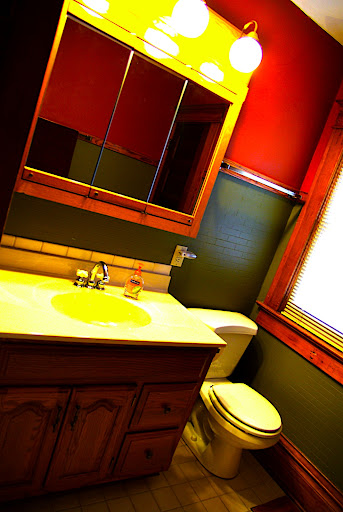 Another view of the bathroom - not quite this yellow.  Well probably replace the towel racks and paint the walls.