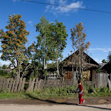 A girl walks with her books in Motygino