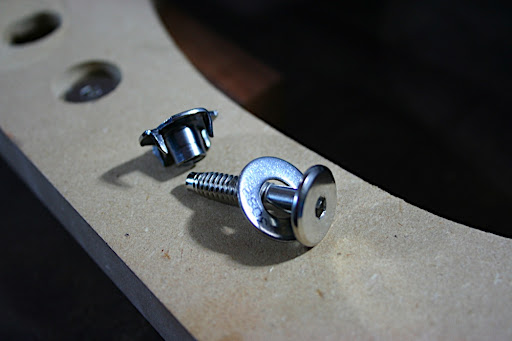 This makes for a much more stable neck joint than the wood screws used in traditional "bolt-on" neck joints. Some manufacturers have designed their neck joints so only two of these bolts are needed. Since we are aiming for a thin neck and neck heel, we'll be using four to start, just for maximum stability. We may revise this later.