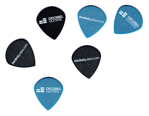 It ain't much, but it's swag! These are 1.0 mm (blue) and .72 mm (black) Jazz III-shaped matte Delrin picks from In Tune Guitar Picks... InTuneGP.com