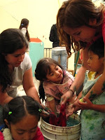 Brown Students Working with Children