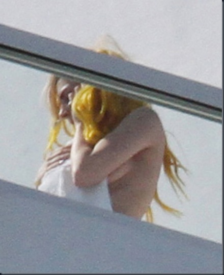 MAVRIXONLINE.COM _ DAILY MAIL ONLINE OUT _ A possibly naked Lady Gaga_ except for a yellow wig_ soaks up the sun with a mystery man on the roof of her luxury hotel_ the Fontainebleau Miami Beach. Lady Gaga_ who loosely covered her modesty with a towel_ twittered earlier that she has two shows later tonight_ New Years Eve_ 13 outfits and she doesn_t care if it_s Miami_ she_s _still wearing leather_. Miami_ FL. 12_31_09.
Fees must be agreed for image use.
Byline_ credit_ TV usage_ web usage or linkback must read MAVRIXONLINE.COM.
Failure to byline correctly will incur double the agreed fee.
Tel_ 305 542 9275 or 954 698 6777.
