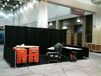 Grant setting up the stand at PAX East