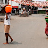 People carrying drinking water in curfew-bound in  Hyderabad's old city on Tuesday.