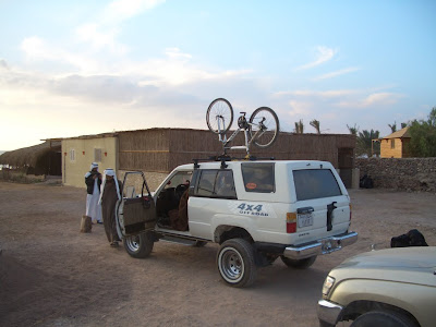 Then we crammed ourselves into our guides Toyota. The bike on top is his.