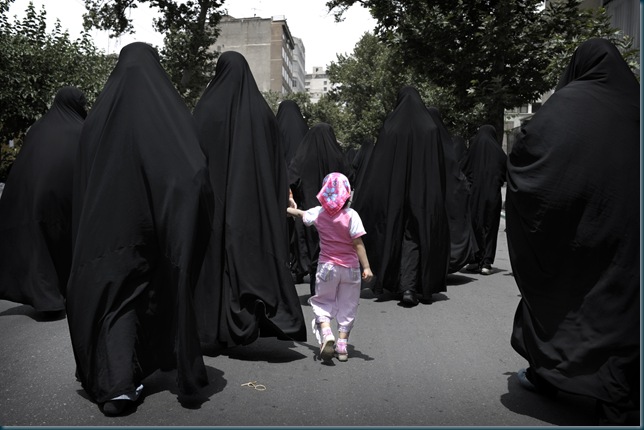 Iranian women walk in a street before the speech of Iran's supreme leader Ayatollah Ali Khamenei outside the Tehran University, on June 19, 2009. Making his first public appearance after daily protests over the official results, Khamenei spoke at the weekly Muslim prayers, called for an end to street protests over last week's disputed presidential election, and sided with declared winner Mahmoud Ahmadinejad. Iranian women walk in a street before the speech of Iran's supreme leader Ayatollah Ali Khamenei outside the Tehran University, on June 19, 2009. Making his first public appearance after daily protests over the official results, Khamenei spoke at the weekly Muslim prayers, called for an end to street protests over last week's disputed presidential election, and sided with declared winner Mahmoud Ahmadinejad.