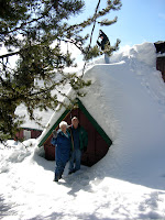 This is my family's cabin in Oregon's Blue Mountains, built by my great grandfather and namesake Isaac (Ike) Holeman. In the summer the sun is warm and you can swim in the lake (see picture of my Dad with motorcycles in the grassy front yard). In the winter the snow keeps piling up; the point of the cabin just above my grandparent's head is actually the second story, so they are standing on at least six or eight feet of snow. This is my family's cabin in Oregon's Blue Mountains, built by my great grandfather and namesake Isaac (Ike) Holeman. In the summer the sun is warm and you can swim in the lake (see picture of my Dad with motorcycles in the grassy front yard). In the winter the snow keeps piling up; the point of the cabin just above my grandparent's head is actually the second story, so they are standing on at least six or eight feet of snow.