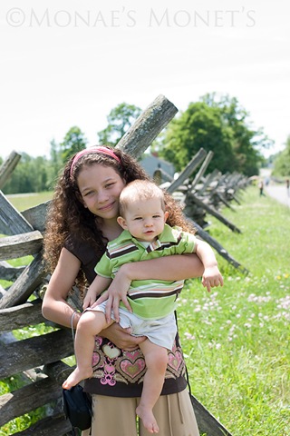 Brianna holding Scott by fence blog Brianna holding Scott by fence blog