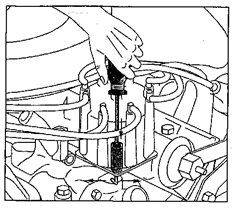 Removing a distributor cap with screw clamps.