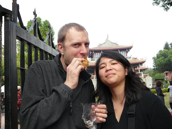 Eating Puffed Sugar in front of Chihkan Tower in Tainan